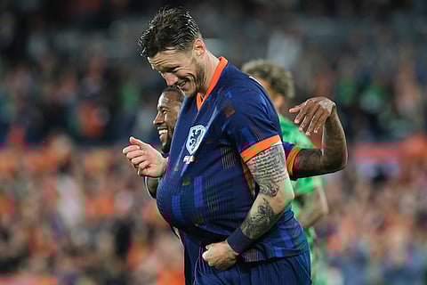 Wout Weghorst celebrates his side's third goal